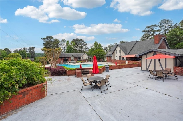 6851 Roswell Rd Unit E1, Atlanta, GA 30328 - view of patio / terrace featuring an outdoor pool and outdoor dining space