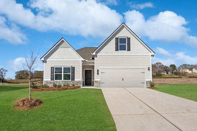 craftsman-style home with a front yard and a garage