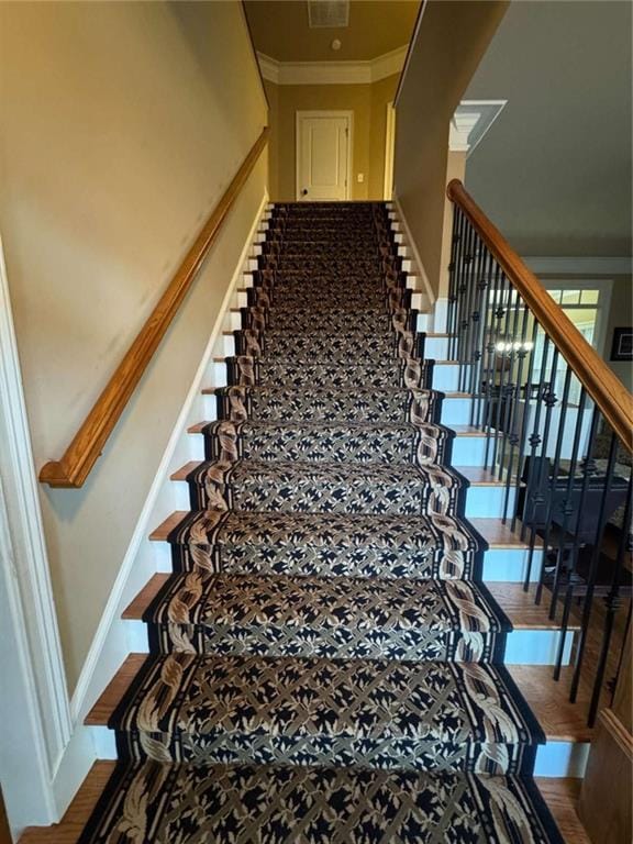 stairs featuring ornamental molding