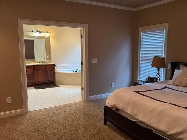 bedroom with ornamental molding, light colored carpet, and ensuite bath