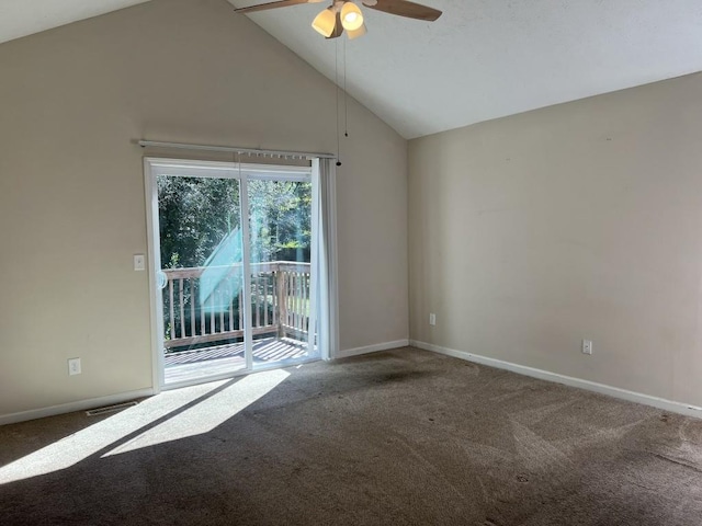 carpeted spare room featuring ceiling fan and high vaulted ceiling