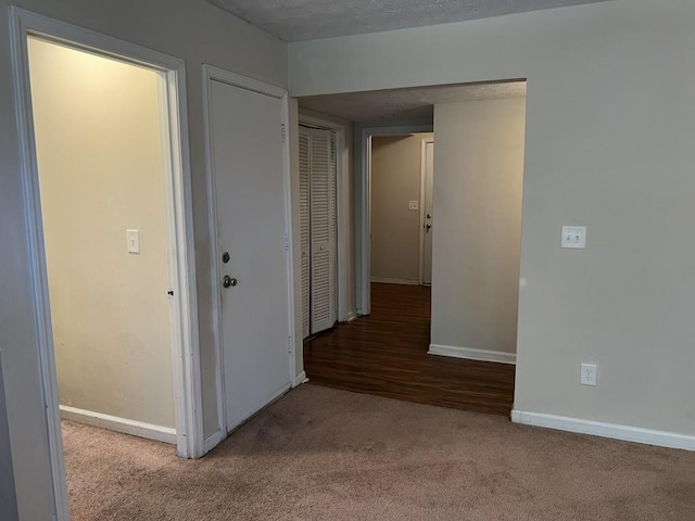 hallway featuring light carpet