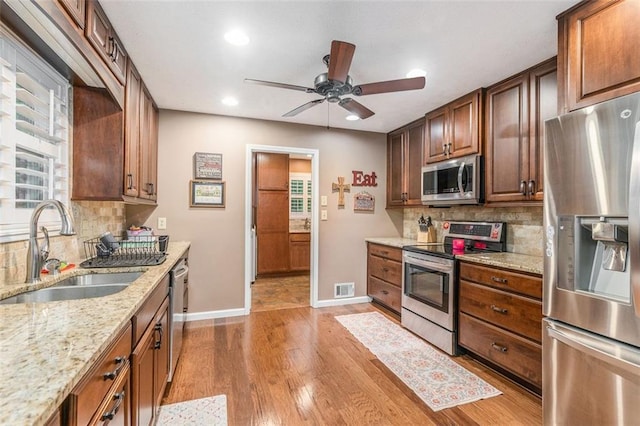 324 Kibbee Rd, Mcdonough, GA 30252 - kitchen featuring appliances with stainless steel finishes, a sink, ceiling fan, recessed lighting, and baseboards