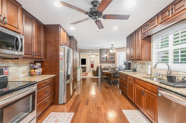 324 Kibbee Rd, Mcdonough, GA 30252 - kitchen featuring stainless steel appliances, ceiling fan, a sink, recessed lighting, and backsplash