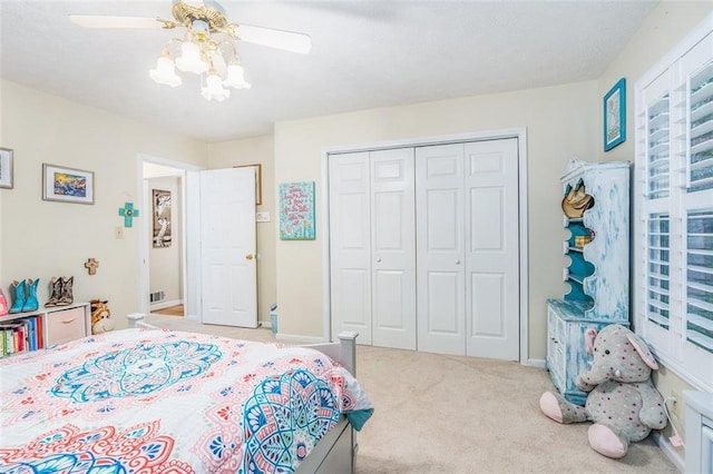 324 Kibbee Rd, Mcdonough, GA 30252 - carpeted bedroom featuring a closet, ceiling fan, and baseboards