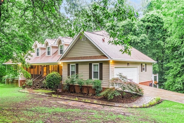 324 Kibbee Rd, Mcdonough, GA 30252 - cape cod home with a garage, covered porch, a front lawn, and driveway