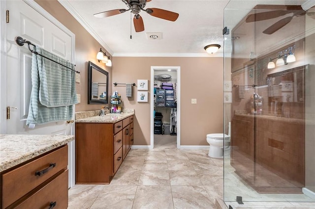 324 Kibbee Rd, Mcdonough, GA 30252 - full bathroom featuring a ceiling fan, vanity, crown molding, a shower stall, and toilet