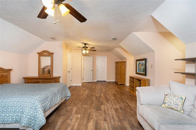 324 Kibbee Rd, Mcdonough, GA 30252 - bedroom featuring wood finished floors, a textured ceiling, vaulted ceiling, baseboards, and a ceiling fan