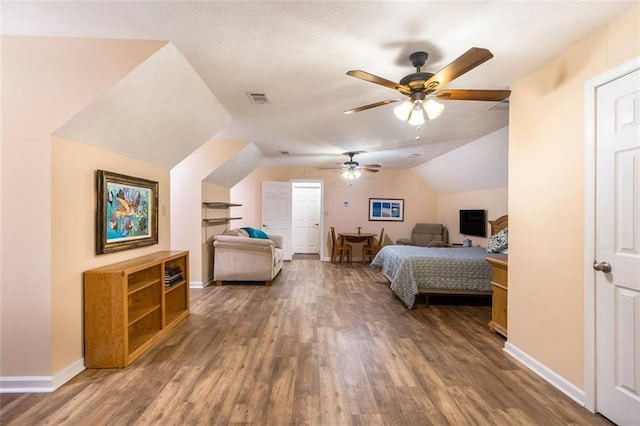 324 Kibbee Rd, Mcdonough, GA 30252 - bedroom featuring wood finished floors, vaulted ceiling, baseboards, and a ceiling fan