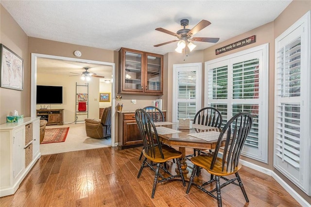 324 Kibbee Rd, Mcdonough, GA 30252 - dining area featuring ceiling fan, wood-type flooring, and a textured ceiling