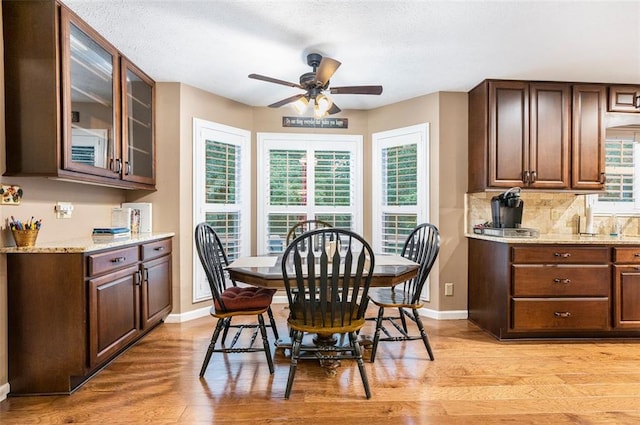 324 Kibbee Rd, Mcdonough, GA 30252 - dining area with a ceiling fan, baseboards, light wood-style floors, and a textured ceiling