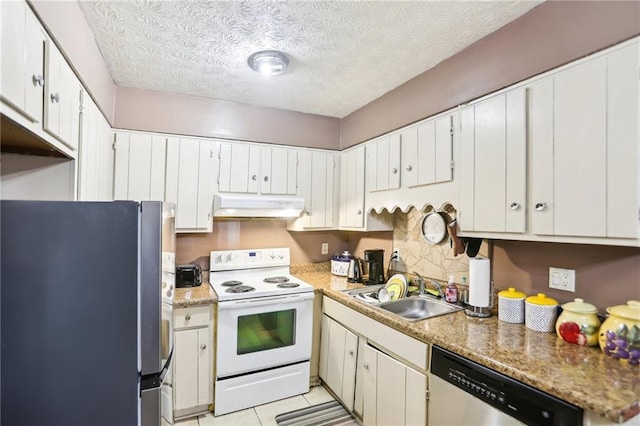 kitchen with white cabinets, appliances with stainless steel finishes, a textured ceiling, under cabinet range hood, and a sink