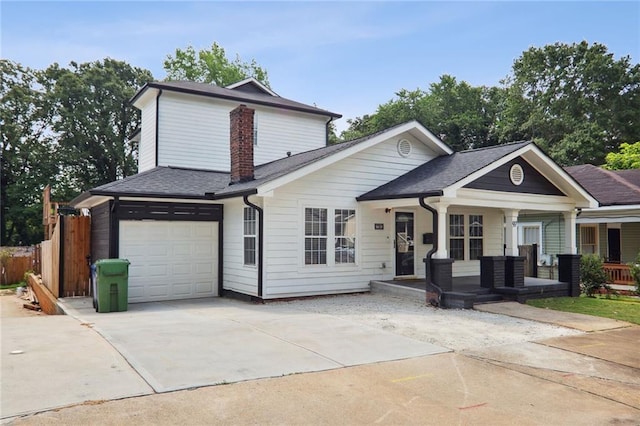 97 Griffin St NW, Atlanta, GA 30314 - view of front of home featuring a porch, concrete driveway, an attached garage, a shingled roof, and a chimney