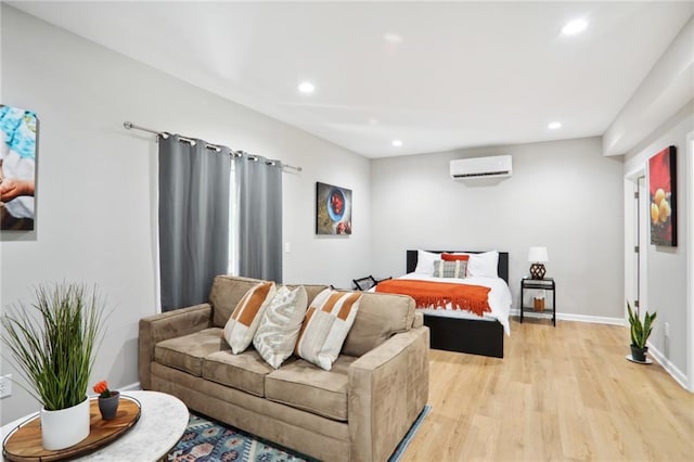 97 Griffin St NW, Atlanta, GA 30314 - bedroom with a wall mounted air conditioner, light wood finished floors, and recessed lighting