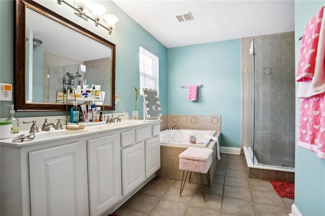 97 Griffin St NW, Atlanta, GA 30314 - full bath with a shower stall, double vanity, a garden tub, and tile patterned flooring