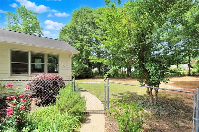 view of yard featuring a gate and fence
