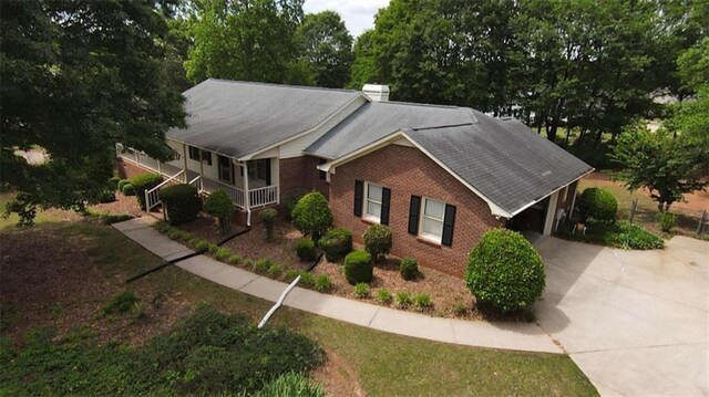 view of front of property featuring a porch and a garage