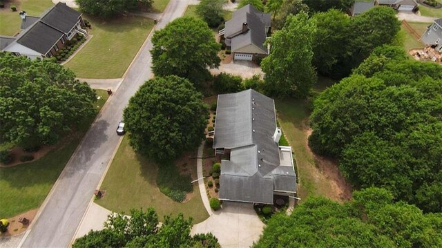 rear view of house with a deck and a yard