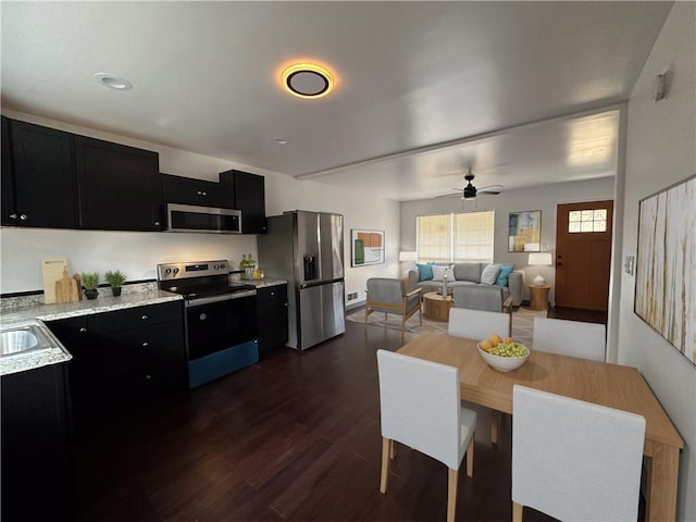 dining area featuring ceiling fan and dark wood-type flooring