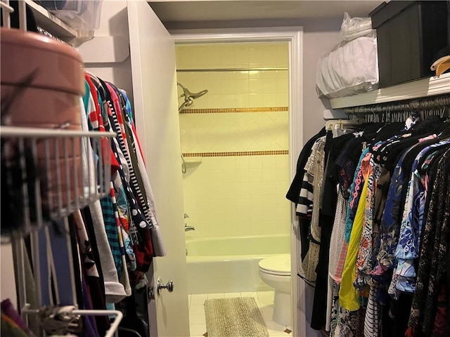 spacious closet featuring tile patterned flooring