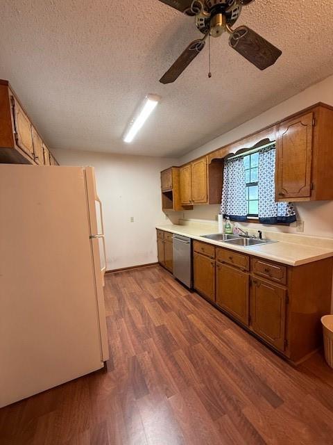 100 Walter Leon Dr, Chatsworth, GA 30705 - kitchen with dishwasher, freestanding refrigerator, a textured ceiling, dark wood-type flooring, and ceiling fan