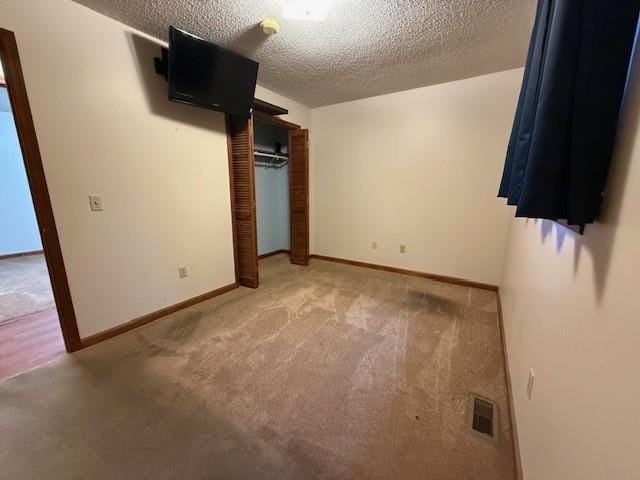 100 Walter Leon Dr, Chatsworth, GA 30705 - unfurnished bedroom featuring a textured ceiling, carpet, and a closet