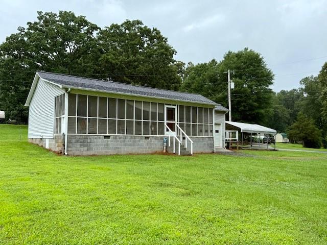 100 Walter Leon Dr, Chatsworth, GA 30705 - back of property with a sunroom and a yard