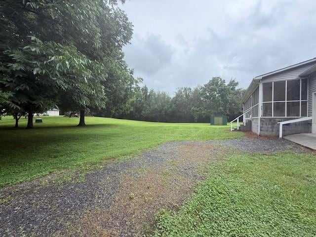 100 Walter Leon Dr, Chatsworth, GA 30705 - view of grassy yard with a sunroom