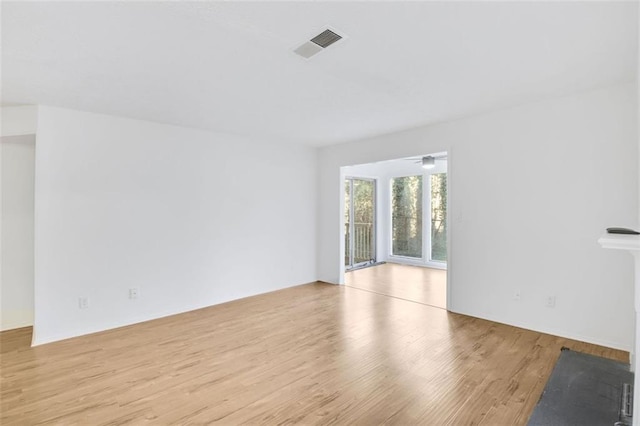 empty room with light hardwood / wood-style floors