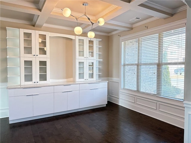 kitchen with coffered ceiling, dark wood-style floors, white cabinetry, open shelves, and beam ceiling