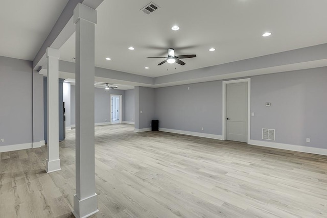 below grade area featuring light wood-type flooring, baseboards, and visible vents