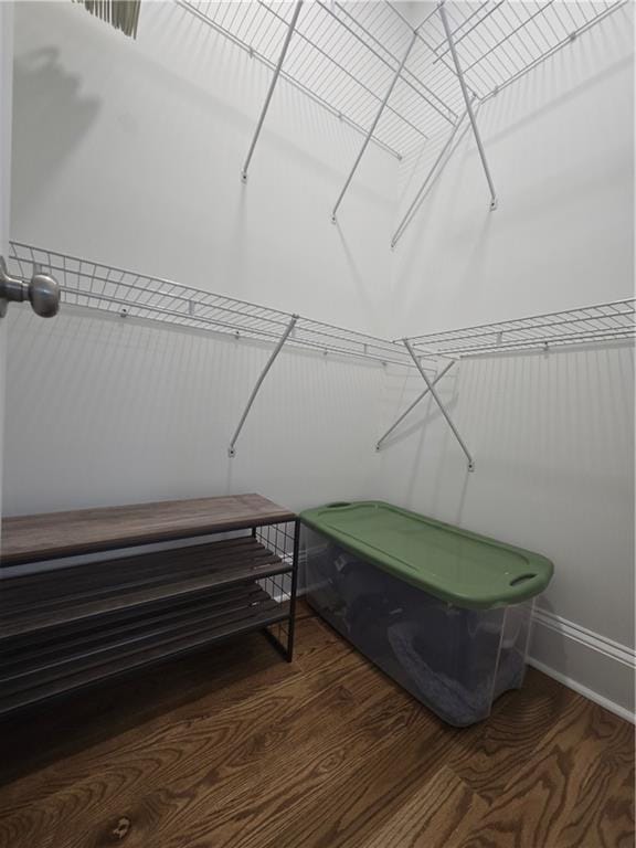 walk in closet featuring wood finished floors and visible vents