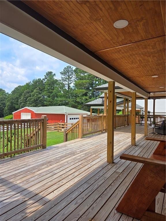 wooden deck featuring an outbuilding