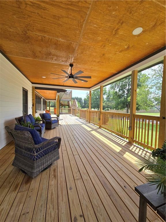 wooden deck with ceiling fan