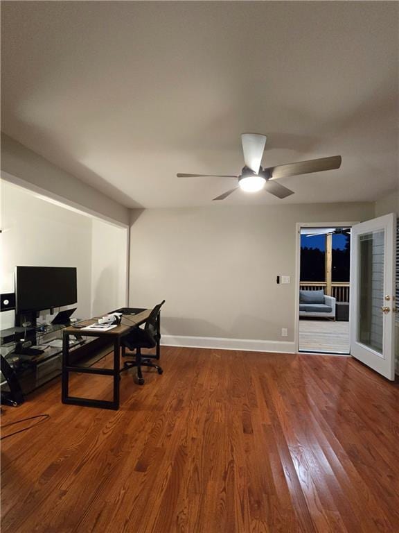 office space with ceiling fan, wood finished floors, and baseboards