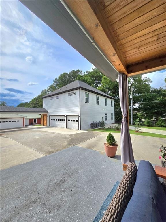 view of patio featuring a garage