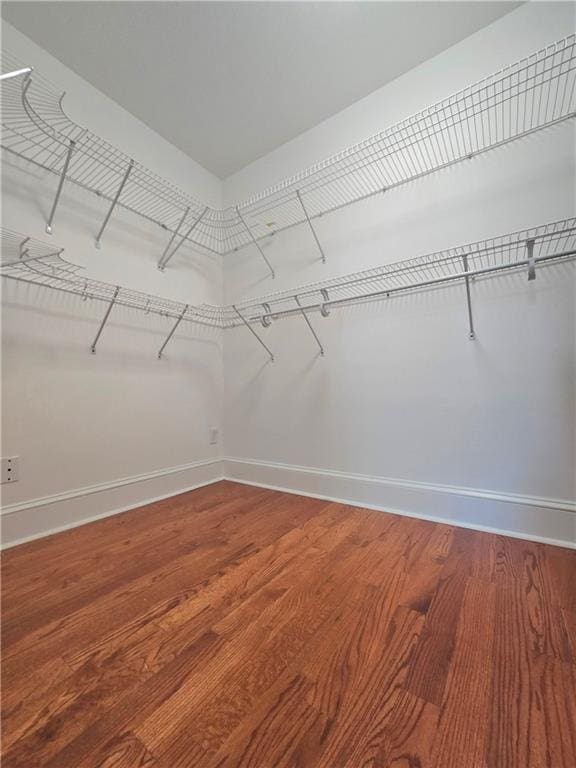 spacious closet with wood finished floors