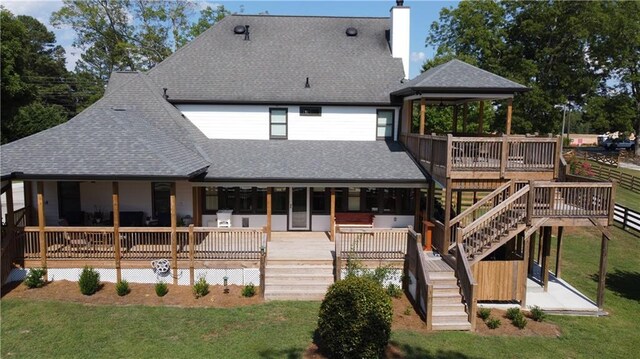 exterior space with an AC wall unit and a wooden deck