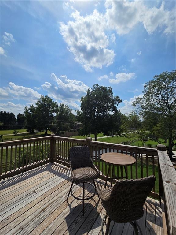 wooden deck with a yard