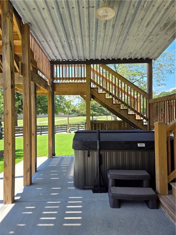 view of patio / terrace with a hot tub