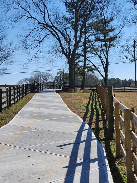 view of community with fence