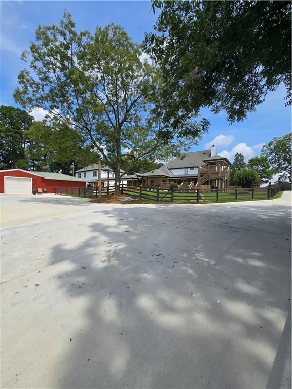 exterior space with fence and an outdoor structure