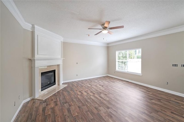 unfurnished living room with a fireplace, ceiling fan, and crown molding