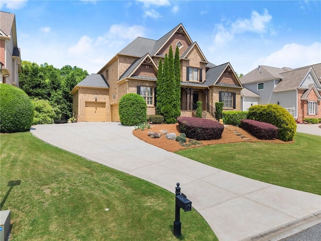 craftsman house featuring brick siding, a garage, a front lawn, and concrete driveway