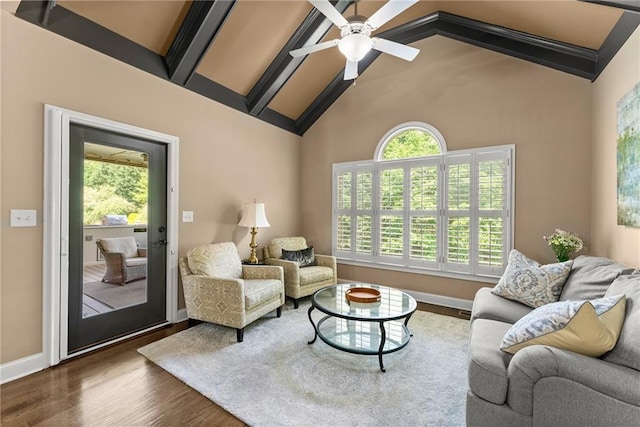 living room featuring baseboards, ceiling fan, wood finished floors, and high vaulted ceiling