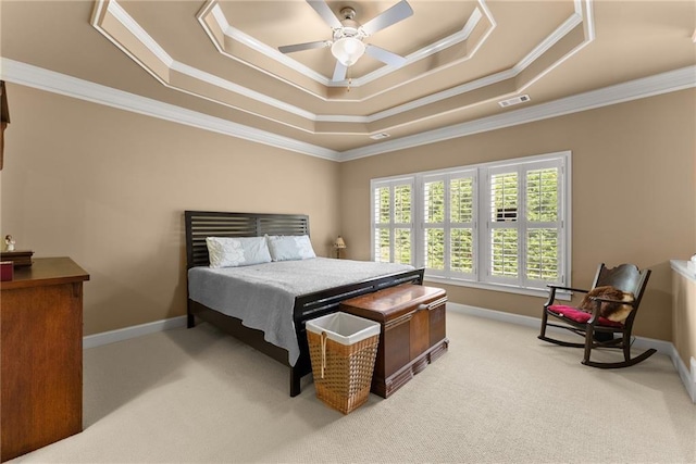 bedroom featuring crown molding, visible vents, light colored carpet, and a raised ceiling