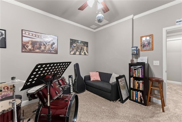 game room featuring baseboards, ornamental molding, carpet flooring, and ceiling fan
