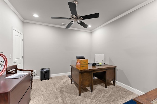 home office with crown molding, a ceiling fan, baseboards, and light colored carpet