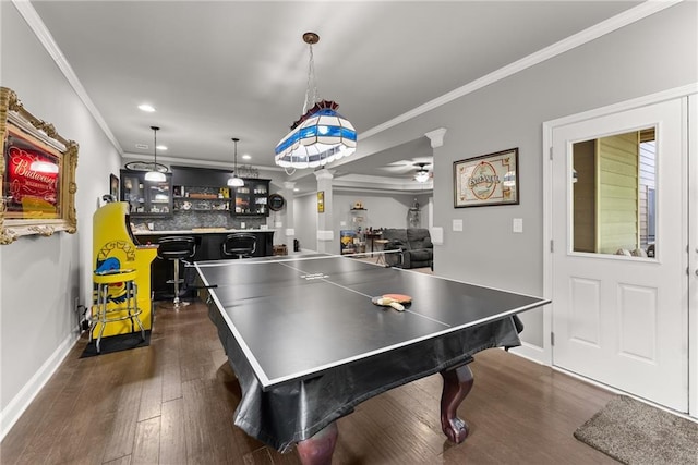 recreation room featuring a ceiling fan, baseboards, dark wood-style floors, ornamental molding, and recessed lighting