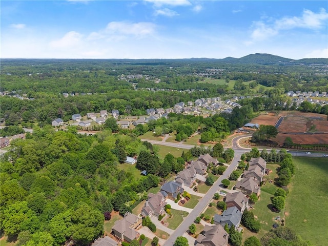aerial view featuring a residential view and a wooded view